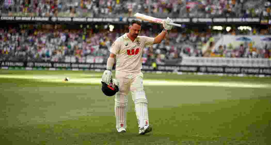 Australia's Travis Head acknowledges the applause as he leaves the ground after losing his wicket on day two of the first Ashes cricket test match between Australia and England in Perth on Saturday. Australia's Travis Head acknowledges the applause as he leaves the ground after losing his wicket on day two of the first Ashes cricket test match between Australia and England in Perth on Saturday.