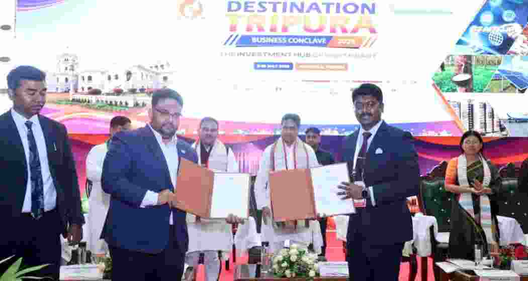 Investors display signed MoU folders during the Destination Tripura Business Conclave 2026 in Agartala as Tripura Chief Minister Manik Saha looks on. Investors display signed MoU folders during the Destination Tripura Business Conclave 2026 in Agartala as Tripura Chief Minister Manik Saha looks on.