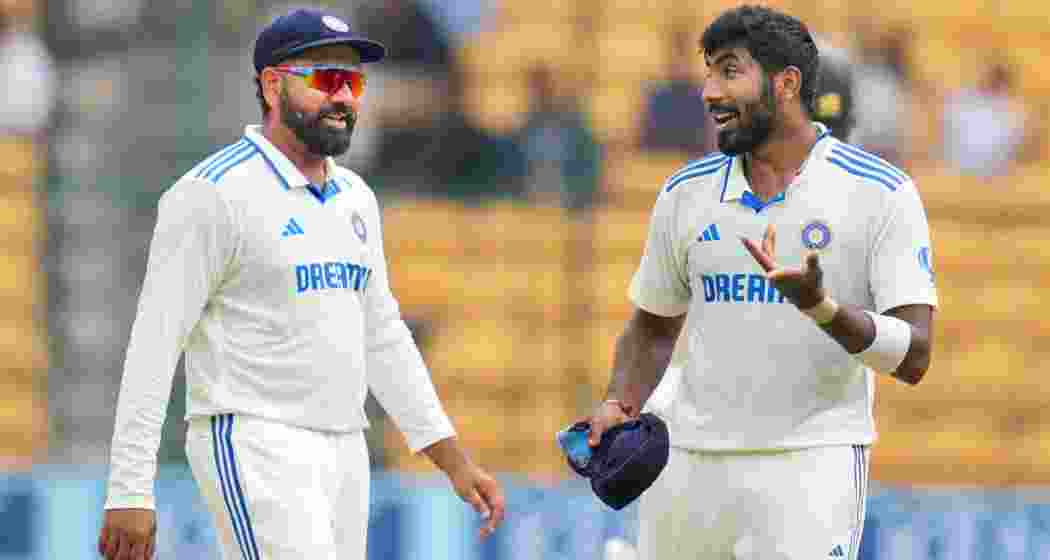 India's Rohit Sharma and Jasprit Bumrah during the fifth day of the first test cricket match between India and New Zealand. India's Rohit Sharma and Jasprit Bumrah during the fifth day of the first test cricket match between India and New Zealand.