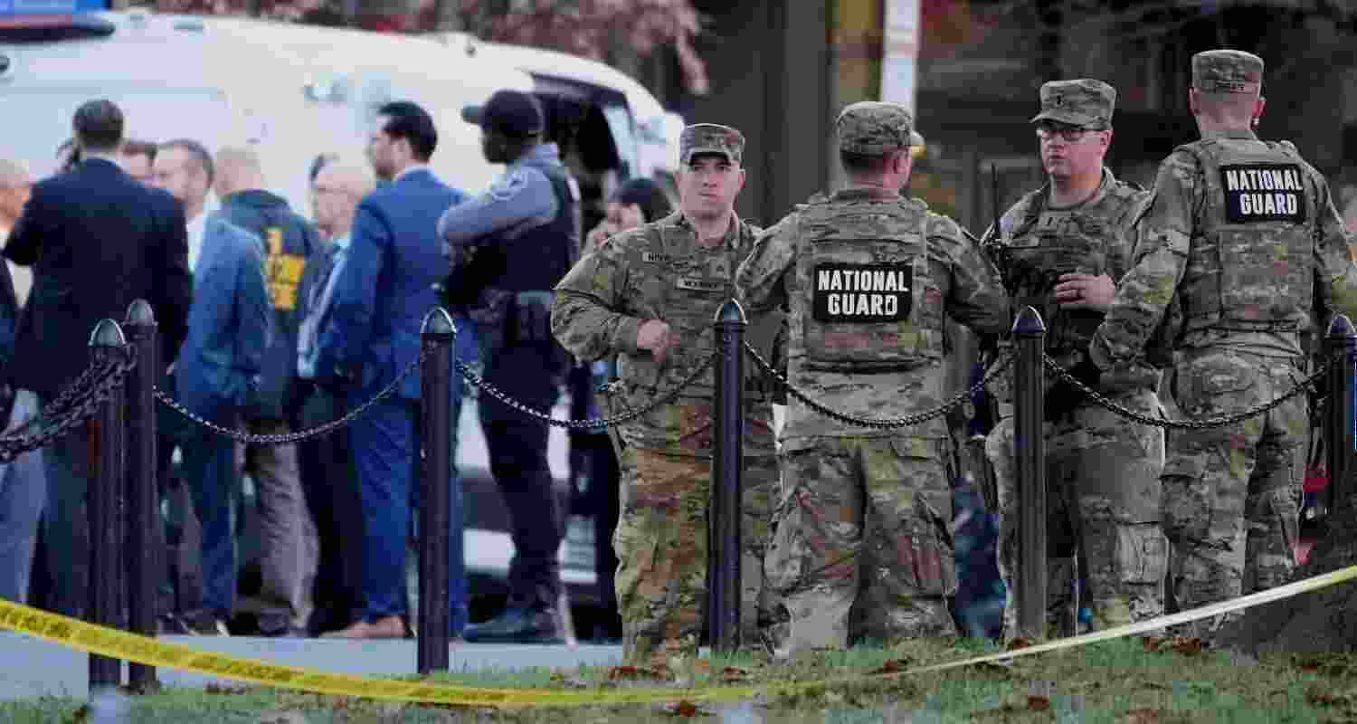 Emergency personnel gather in a cordoned off area where National Guard soldiers were shot near the White House Wednesday. Emergency personnel gather in a cordoned off area where National Guard soldiers were shot near the White House Wednesday.