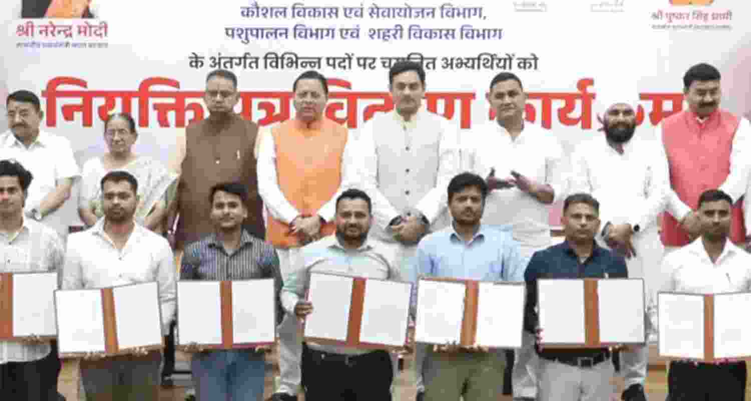 Uttarakhand CM Pushkar Singh Dhami distributes appointment letters in Dehradun . Uttarakhand CM Pushkar Singh Dhami distributes appointment letters in Dehradun .