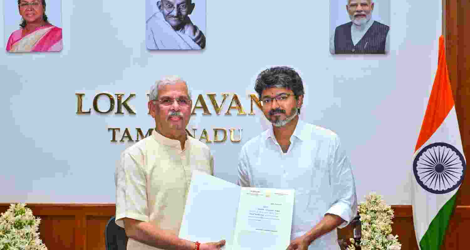 Tamil Nadu Governor Rajendra Vishwanath Arlekar hands over the letter of appointment to TVK chief C Joseph Vijay as the new state Chief Minister, at the Lok Bhavan, in Chennai on Saturday. Tamil Nadu Governor Rajendra Vishwanath Arlekar hands over the letter of appointment to TVK chief C Joseph Vijay as the new state Chief Minister, at the Lok Bhavan, in Chennai on Saturday.