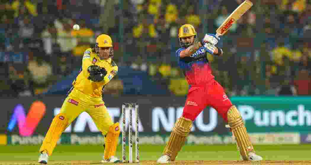 RCB’s star batter Virat Kohli in action during an IPL clash against Chennai Super Kings, as MS Dhoni, behind the stumps, keeps a close eye on proceedings. RCB’s star batter Virat Kohli in action during an IPL clash against Chennai Super Kings, as MS Dhoni, behind the stumps, keeps a close eye on proceedings.