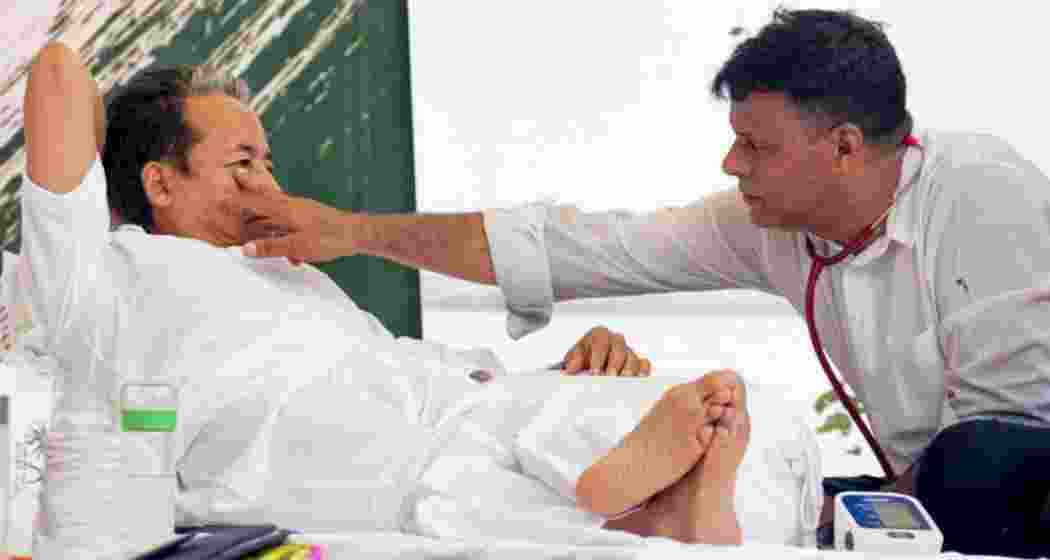 Activist Sonam Wangchuk being attended by a medical professional amid an ongoing hunger strike at Jantar Mantar during a protest over alleged examination irregularities, repeated paper leaks and demands for accountability from the government, in New Delhi, on Wednesday. Activist Sonam Wangchuk being attended by a medical professional amid an ongoing hunger strike at Jantar Mantar during a protest over alleged examination irregularities, repeated paper leaks and demands for accountability from the government, in New Delhi, on Wednesday.