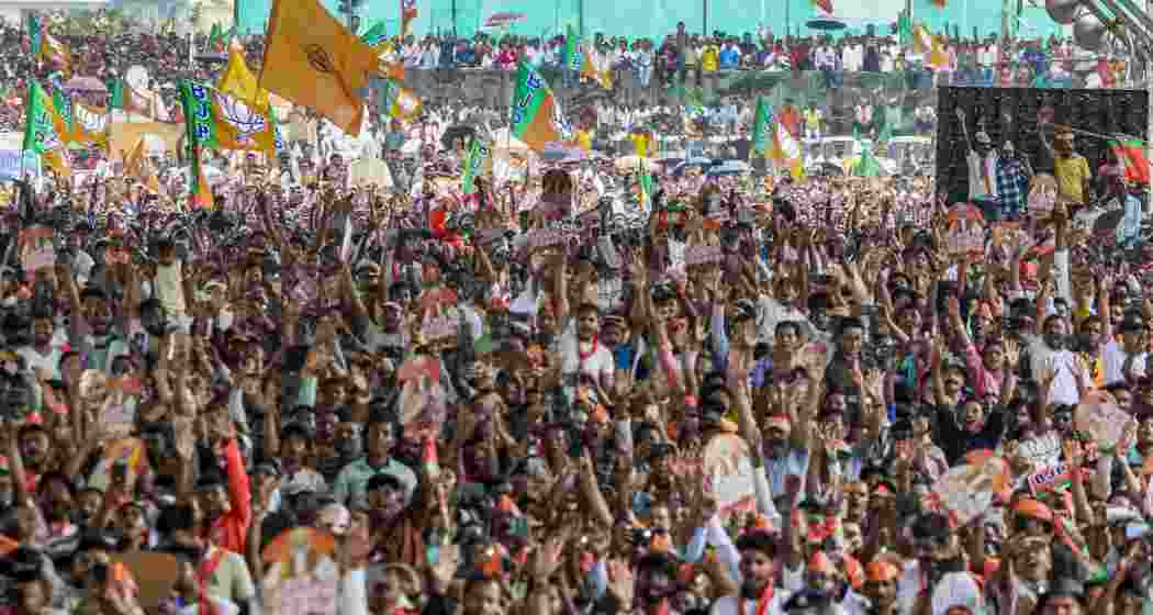 Supporters gather during a public meeting led by Prime Minister Narendra Modi ahead of the West Bengal Assembly elections, in Siliguri on Sunday. (narendramodi.in via PTI Photo) Supporters gather during a public meeting led by Prime Minister Narendra Modi ahead of the West Bengal Assembly elections, in Siliguri on Sunday. (narendramodi.in via PTI Photo)