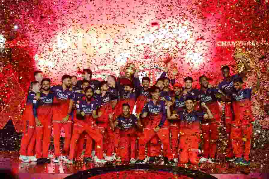 RCB players celebrating after receiving the IPL trophy in Bengaluru. RCB players celebrating after receiving the IPL trophy in Bengaluru.