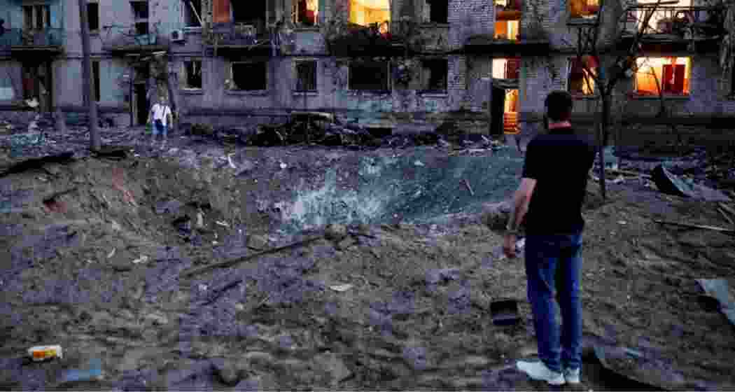 Explosions formed a crater next to bombed-out buildings in Kyiv. Explosions formed a crater next to bombed-out buildings in Kyiv.