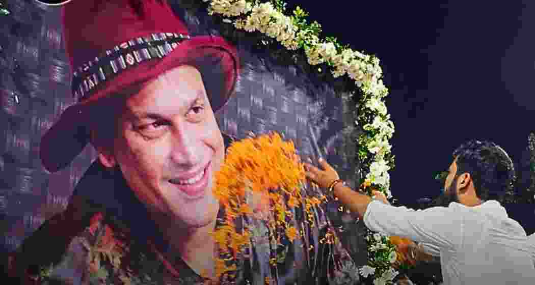 A fan pays tribute to late singer Zubeen Garg, offering flowers and respects at a memorial site in Guwahati. A fan pays tribute to late singer Zubeen Garg, offering flowers and respects at a memorial site in Guwahati.